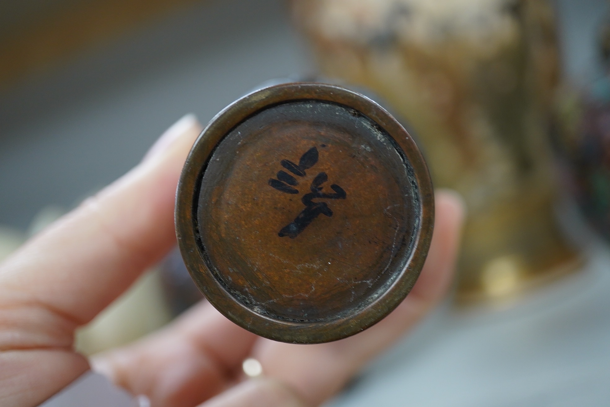 A pair of Japanese cloisonné enamel jars and covers, a Japanese bronze and gold overlaid small vase and a Satsuma pottery vase, tallest 22cm high (4). Condition - finial loose and one missing on cloisonné jars and covers